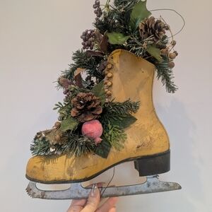 Decorative Yellow Ice Skate with Pinecones and Greenery